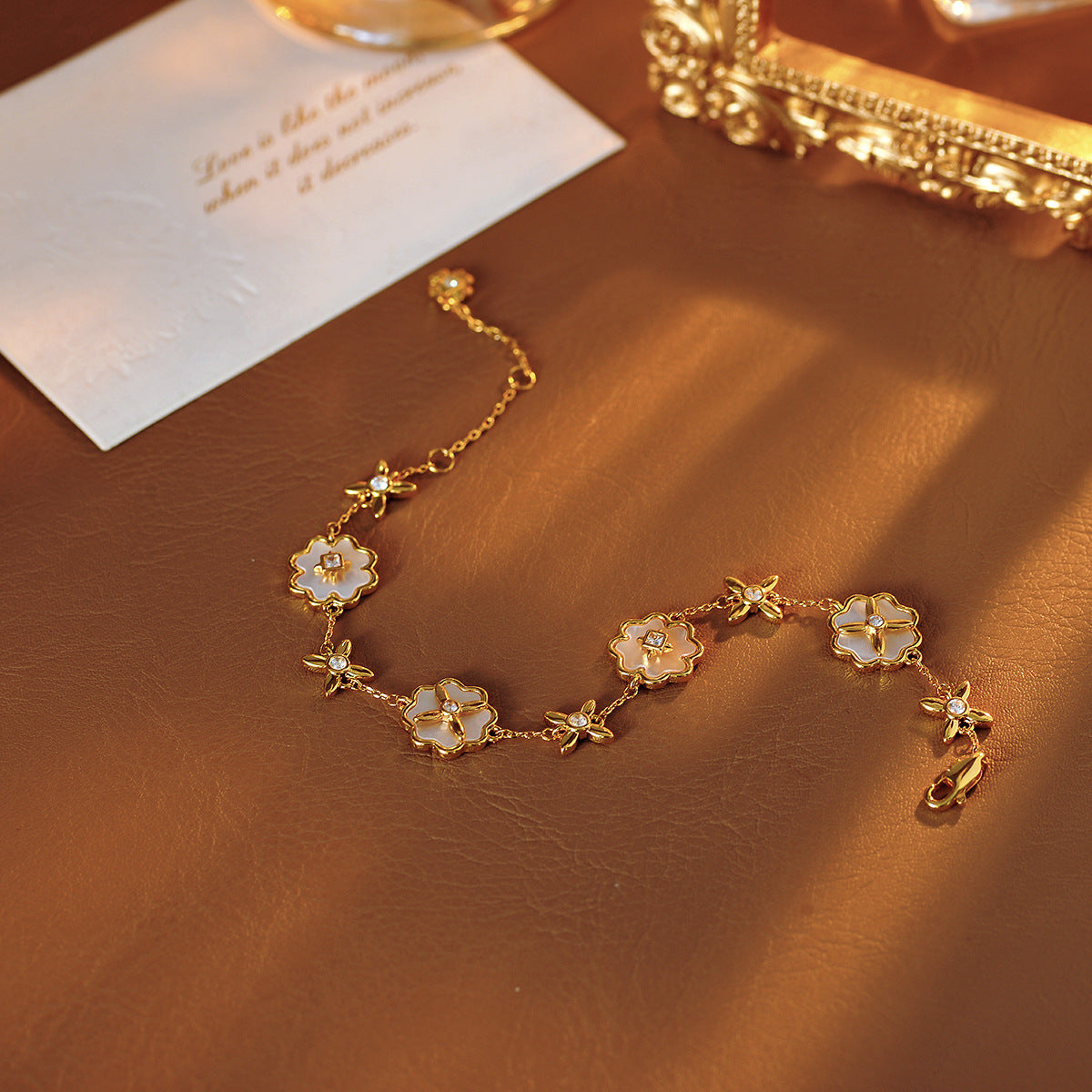 European and American Sweet Fashion Inlaid Fritillary Four-leaf Clover Flower Gold-plated Multi-pendant Bracelet