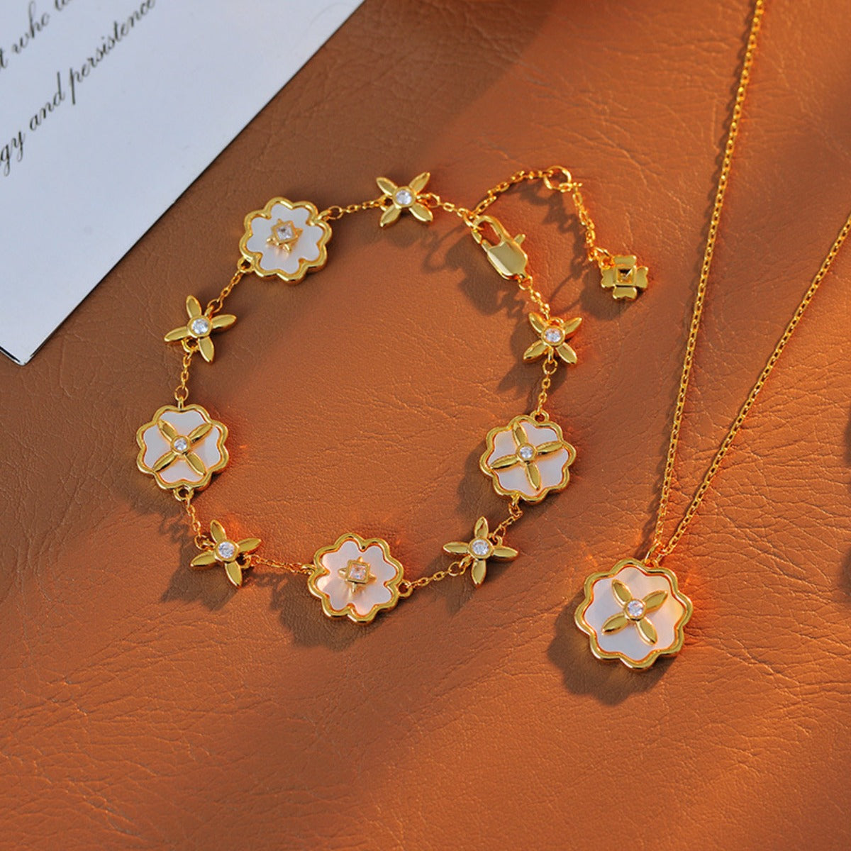 European and American Sweet Fashion Inlaid Fritillary Four-leaf Clover Flower Gold-plated Multi-pendant Bracelet